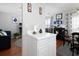 Kitchen with white cabinets, view into adjacent dining area at 253 Gallant Se # 17, Mableton, GA 30126