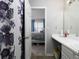 Bathroom features a shower, vanity, and view into bedroom at 253 Gallant Se # 17, Mableton, GA 30126