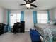 Main bedroom with king bed, ceiling fan, home office, and teal accents at 253 Gallant Se # 17, Mableton, GA 30126