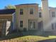 Townhouse backyard with patio and small lawn at 6348 Wellington Walk Way, Lithonia, GA 30058