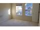 Simple bedroom with carpet and two windows at 6348 Wellington Walk Way, Lithonia, GA 30058