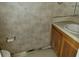 Small bathroom with sink, toilet, and patterned wallpaper at 6348 Wellington Walk Way, Lithonia, GA 30058