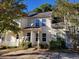 Beige townhouse with a satellite dish and small yard at 6348 Wellington Walk Way, Lithonia, GA 30058