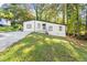 House exterior with driveway and landscaped yard at 2396 Abner Nw Pl, Atlanta, GA 30318