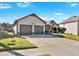Two-story house with two-car garage and landscaped yard at 911 Mcduffie Cir, Douglasville, GA 30134