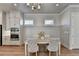 Bright dining area with wood floors and modern chandelier at 4627 Molder Dr, Buford, GA 30518