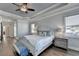 Spacious main bedroom with hardwood floors, a ceiling fan and ensuite bathroom at 4627 Molder Dr, Buford, GA 30518