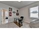 Multi-purpose room with a glass desk and built-in shelving at 4627 Molder Dr, Buford, GA 30518