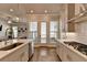 Modern kitchen with island, stainless steel appliances and backyard access at 4627 Molder Dr, Buford, GA 30518