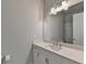 Modern bathroom with white vanity, large mirror, and subway tile shower at 4627 Molder Dr, Buford, GA 30518