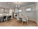 Bright dining area with wood floors and modern chandelier at 4627 Molder Dr, Buford, GA 30518