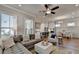 Open living space with sectional sofa and kitchen view at 4627 Molder Dr, Buford, GA 30518