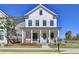 Two-story white house with a front porch at 4627 Molder Dr, Buford, GA 30518