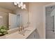 Bathroom with single vanity, quartz countertop, and a walk-in shower at 4627 Molder Dr, Buford, GA 30518