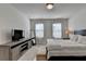 Bright bedroom with a king-size bed and plenty of natural light at 4627 Molder Dr, Buford, GA 30518