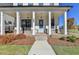 Brick front porch with light blue door at 4627 Molder Dr, Buford, GA 30518