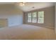 Bright bedroom with vaulted ceiling and multiple windows at 2404 Lake Cove Ct, Lithonia, GA 30058