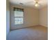 Bright bedroom with window and ceiling fan at 2404 Lake Cove Ct, Lithonia, GA 30058