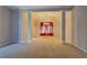 Open living room with neutral colors and view to dining area at 2404 Lake Cove Ct, Lithonia, GA 30058