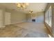 Spacious living room featuring a fireplace and ample natural light at 2404 Lake Cove Ct, Lithonia, GA 30058