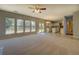 Gathering Room with backyard access and ceiling fan at 2404 Lake Cove Ct, Lithonia, GA 30058