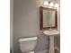 Updated bathroom with pedestal sink and modern fixtures at 2404 Lake Cove Ct, Lithonia, GA 30058