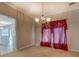 Dining room with chandelier and red curtains at 2404 Lake Cove Ct, Lithonia, GA 30058