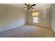 Bedroom with ceiling fan and window coverings at 2404 Lake Cove Ct, Lithonia, GA 30058