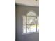 Large arched window with a geometric light fixture at 2404 Lake Cove Ct, Lithonia, GA 30058