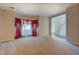 Spacious living room with carpeting and bay window at 2404 Lake Cove Ct, Lithonia, GA 30058