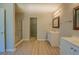 Bathroom with shower, tub, and double vanity at 2404 Lake Cove Ct, Lithonia, GA 30058