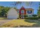 Two story house with brick and siding exterior at 2404 Lake Cove Ct, Lithonia, GA 30058