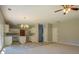 Gathering room with kitchen view and ceiling fan at 2404 Lake Cove Ct, Lithonia, GA 30058