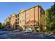 Brick building exterior with ample parking at 2300 Peachford Rd # 1205, Dunwoody, GA 30338