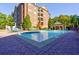 Resort-style pool with plenty of lounge chairs and a gazebo at 2300 Peachford Rd # 1205, Dunwoody, GA 30338