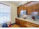 Well-equipped community kitchen featuring granite countertops and wood cabinets at 2300 Peachford Rd # 1205, Dunwoody, GA 30338