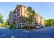 Modern brick building with parking and landscaping at 2300 Peachford Rd # 1205, Dunwoody, GA 30338