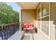 Private balcony overlooking trees with seating for two at 2300 Peachford Rd # 1205, Dunwoody, GA 30338