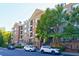 Brick building exterior with ample parking and landscaping at 2300 Peachford Rd # 1205, Dunwoody, GA 30338