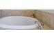 Oval garden bathtub with tile surround at 2300 Peachford Rd # 1205, Dunwoody, GA 30338