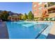 Inviting community pool with plenty of lounge chairs at 2300 Peachford Rd # 1205, Dunwoody, GA 30338