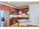 Modern kitchen with granite countertops and stainless steel appliances at 2300 Peachford Rd # 1205, Dunwoody, GA 30338
