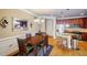 Open concept dining area with kitchen views and hardwood floors at 2300 Peachford Rd # 1205, Dunwoody, GA 30338