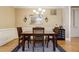 Bright dining room featuring hardwood floors and a chandelier at 2300 Peachford Rd # 1205, Dunwoody, GA 30338
