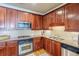 Modern kitchen with stainless steel appliances and granite countertops at 2300 Peachford Rd # 1205, Dunwoody, GA 30338