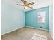 Bedroom with light blue walls, ceiling fan and carpet flooring at 75 Lundy Ln, Jonesboro, GA 30238