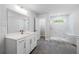 Modern bathroom with white vanity and marble shower at 118 Briargate Dr, Johns Creek, GA 30097