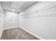 Spacious walk-in closet with wire shelving at 118 Briargate Dr, Johns Creek, GA 30097