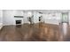 Open living area with hardwood floors and fireplace at 118 Briargate Dr, Johns Creek, GA 30097