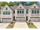 Three-unit townhome building with modern farmhouse exteriors at 118 Briargate Dr, Johns Creek, GA 30097